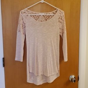 A swoop neck blouse with sheer cutouts